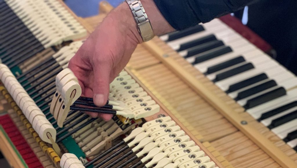Inside view of a piano outfitted with 3D printed plastic hammers
