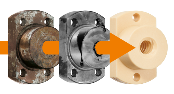 A corroded metal lead screw nut next to a non-corroded lead screw nut and a plastic lead screw nut, with an arrow pointing left to right through each